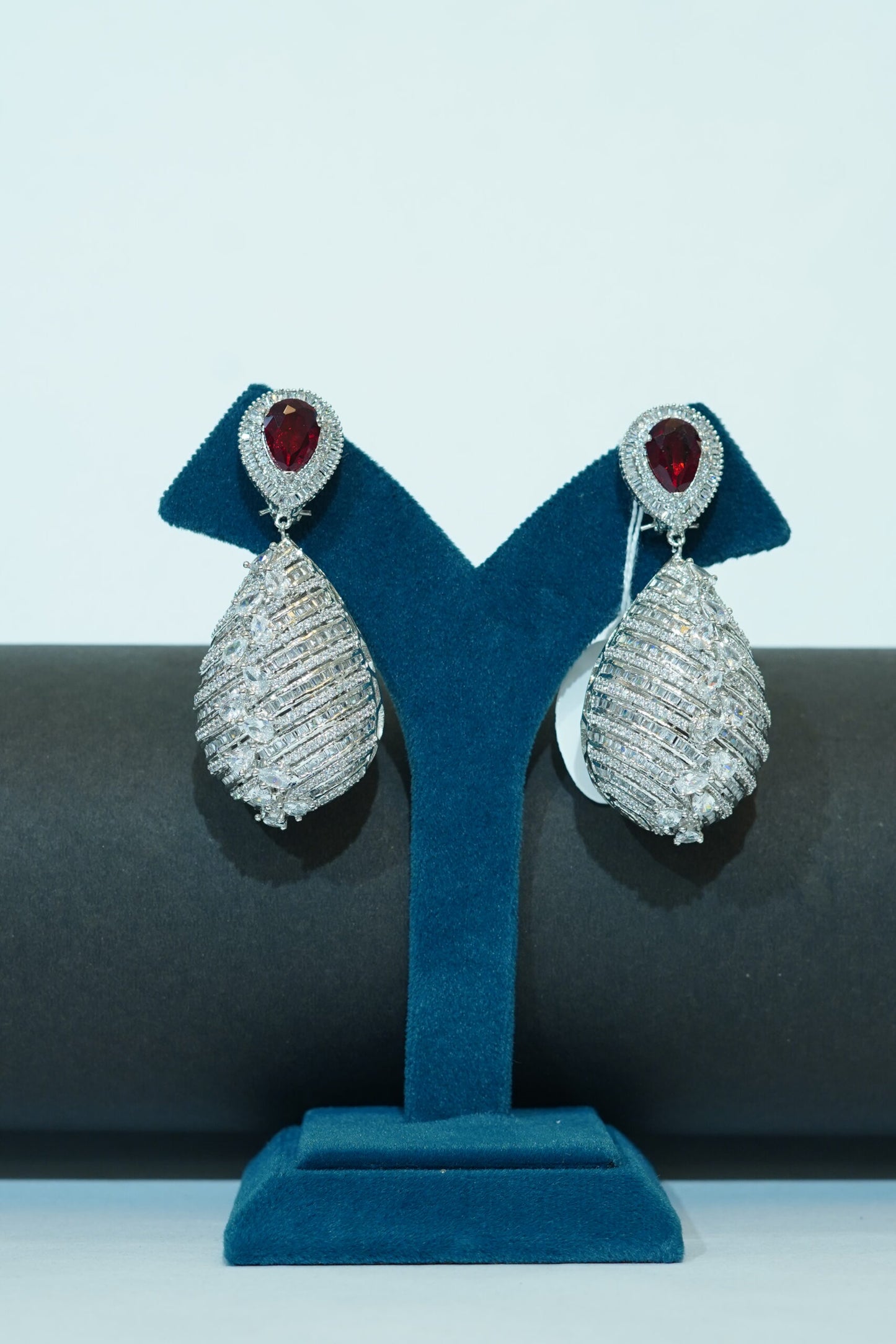 Silver toned & red stone drop earrings