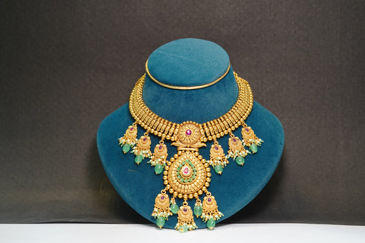 Gold toned &amp; green stone necklace