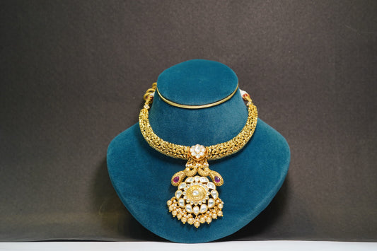 Gold toned with flower detailing prominent necklace