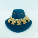Gold plated green stone studded choker