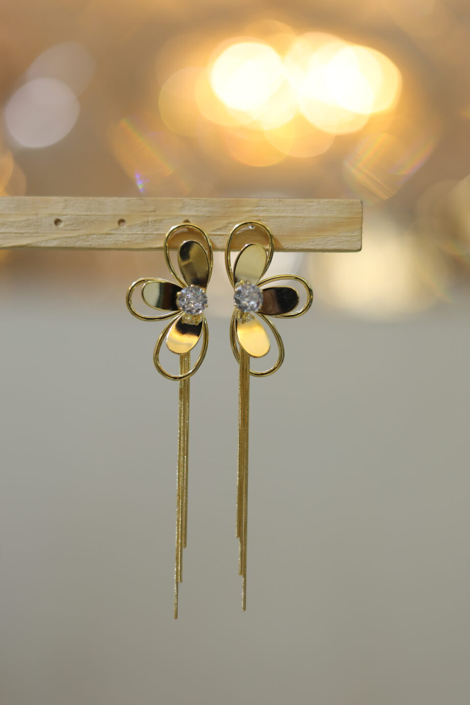 Half flower gold toned earrings
